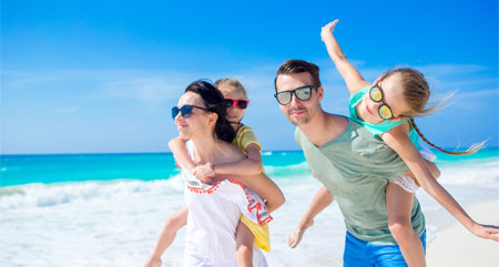 family having fun on a beach