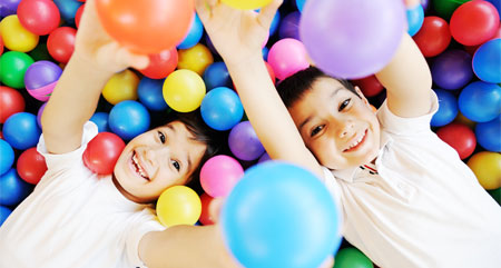 kids having fun in a ball pit